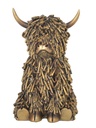 SHAGGY COW SITTING